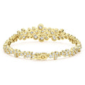 back of cluster diamond tennis bracelet set in 18K gold with box closure on white background
