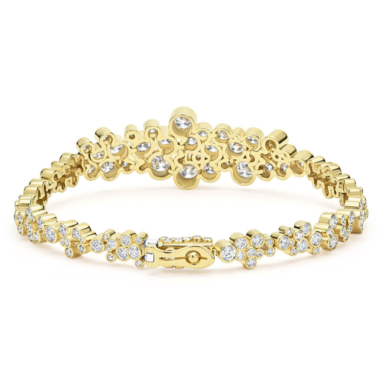 back of cluster diamond tennis bracelet set in 18K gold with box closure on white background