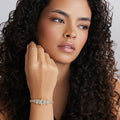 Woman wearing the 18K Gold Cluster Diamond Statement Bracelet