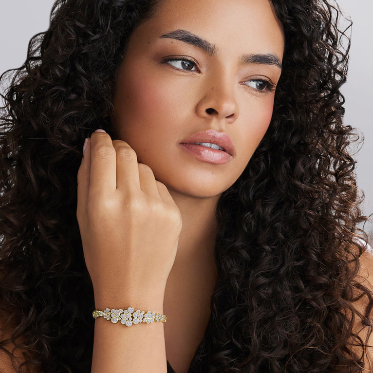 Woman wearing the 18K Gold Cluster Diamond Statement Bracelet