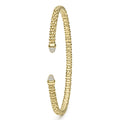 Signature Caviar 18K Gold Diamond Mini Versa Torque Bracelet, showcasing flexible beaded bangles with diamond-capped ends, crafted in sleek 3mm 18K gold for a refined, minimalist look.