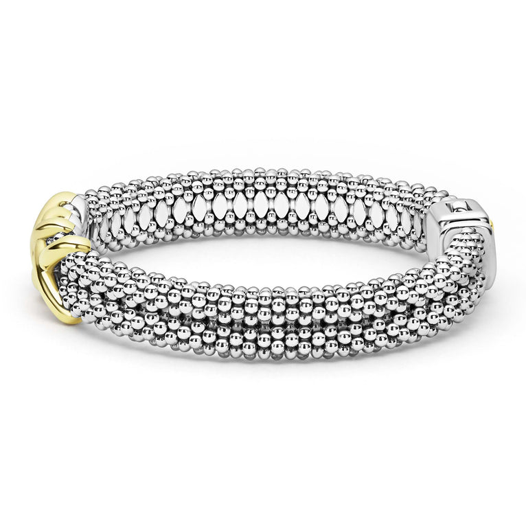 side of thick sterling silver beaded bracelet with gold x details