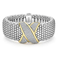 An 18K gold and diamond X station wraps this sterling silver Caviar beaded statement bracelet. LAGOS diamonds are the highest quality natural stones.
