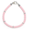 A pink ceramic Caviar bracelet accented by five sterling silver stations.