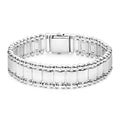 Sterling silver with an 18K gold crest accent on the clasp forms this link bracelet.
