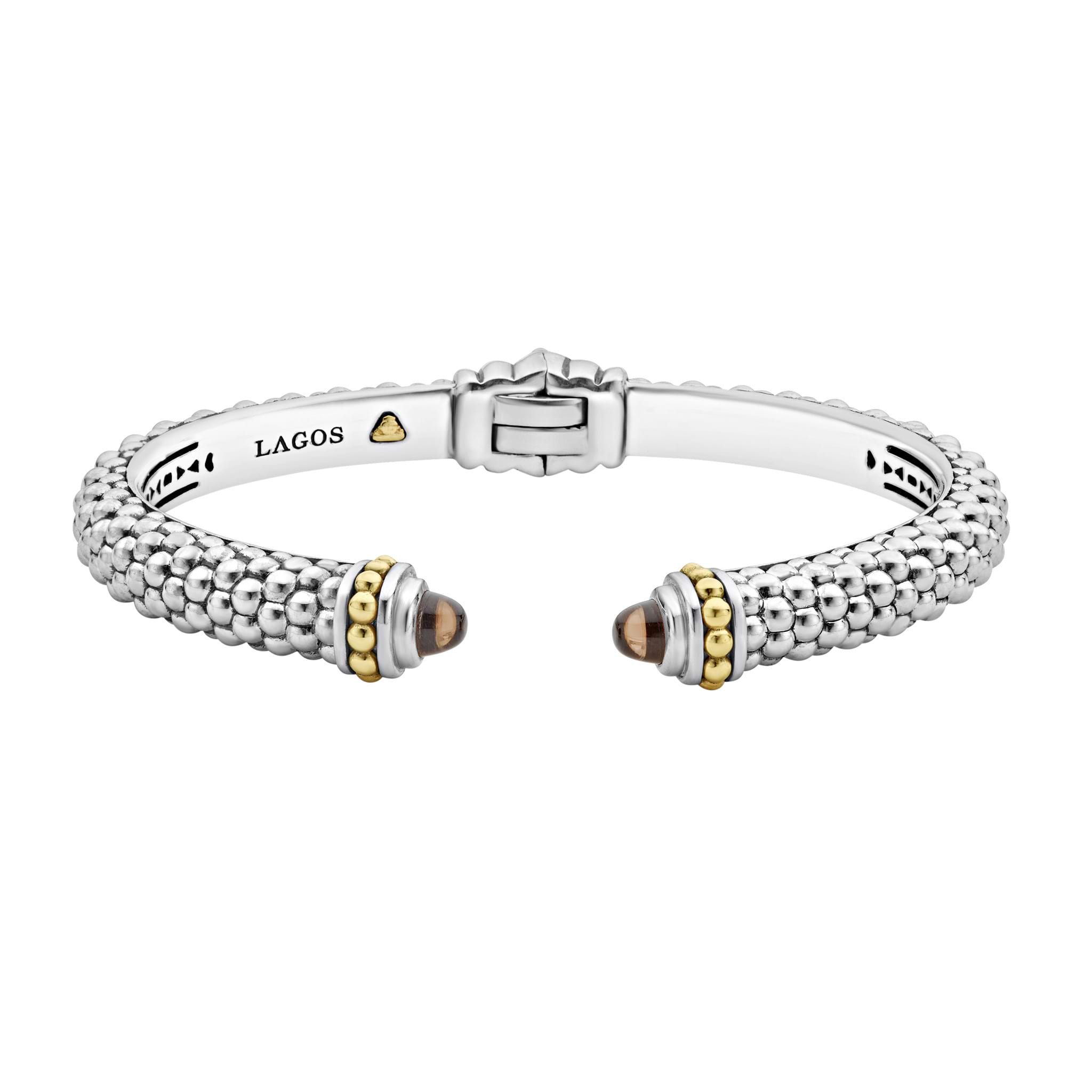 Caviar beading with highly polished sterling silver stations comprise this innovative cuff bracelet detailing faceted smokey quartz gemstone end caps. Finished with a hinge clasp.