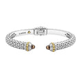 Caviar beading with highly polished sterling silver stations comprise this innovative cuff bracelet detailing faceted smokey quartz gemstone end caps. Finished with a hinge clasp.