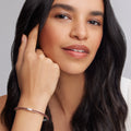 Model wearing silver and Garnet Bangle Bracelet