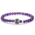 Amethyst gemstone beaded bracelet with a sterling silver Caviar skull.