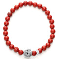 Anthem Red Jasper Skull Bead Bracelet featuring polished red beads, a sterling silver spacer, and a sterling silver metal skull, showcasing fine craftsmanship.