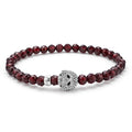 Red garnet gemstone bracelet with a sterling silver Caviar skull.