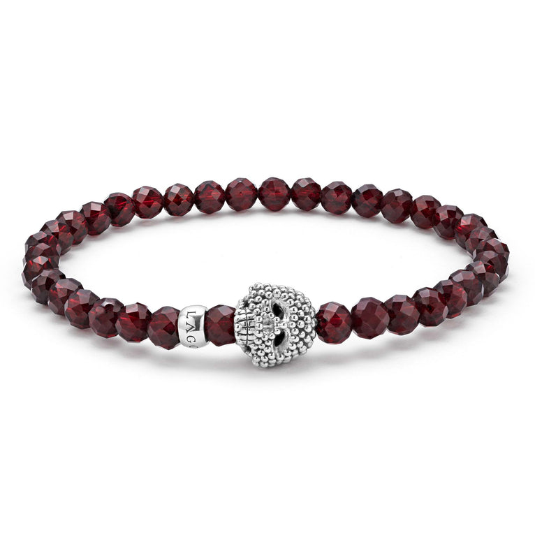Red garnet gemstone bracelet with a sterling silver Caviar skull.