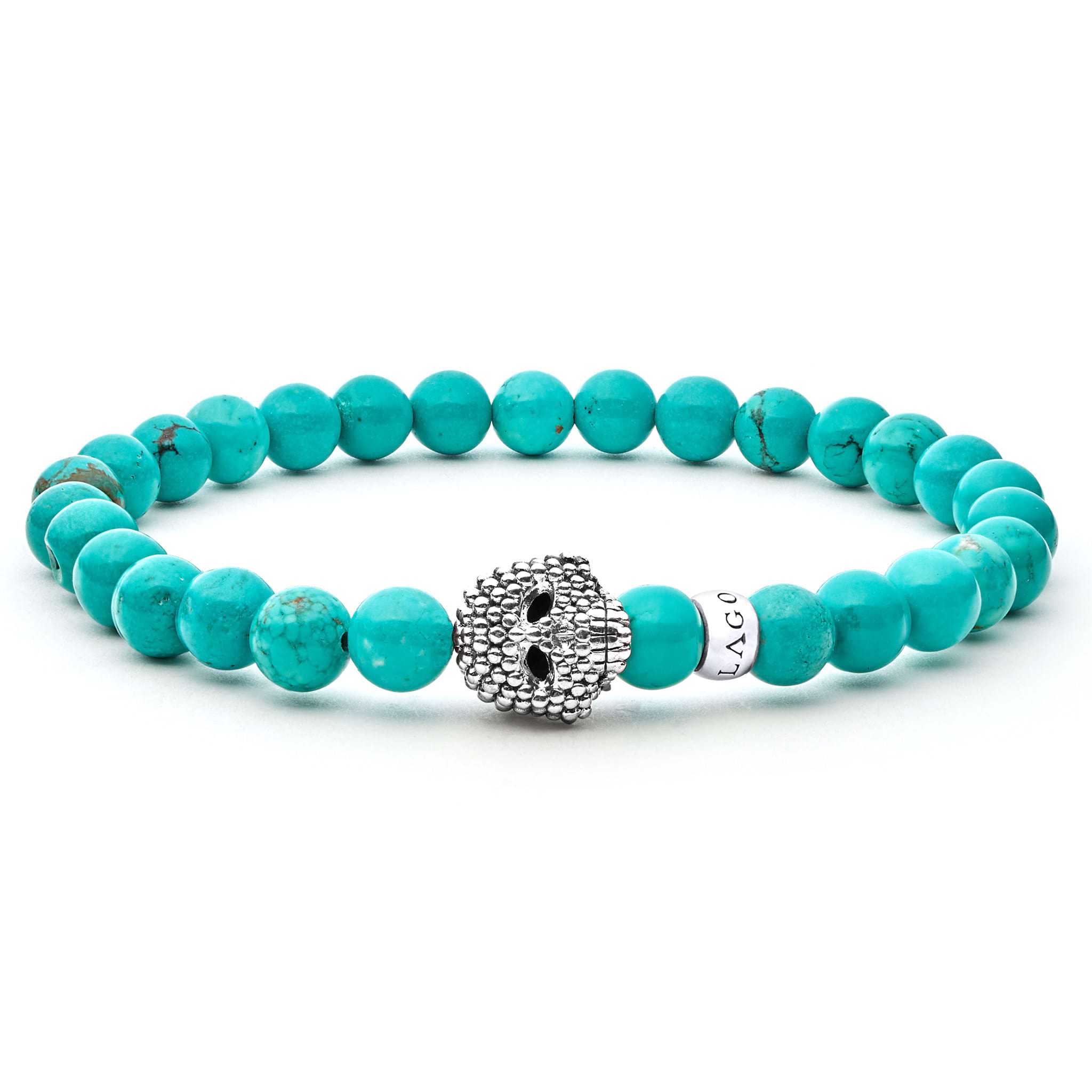 Turquoise gemstone beaded bracelet with a sterling silver Caviar skull.