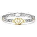 18K gold and sterling silver Caviar beading form this signature interlocking bracelet.