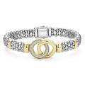 Two diamond circles set in 18K gold highlight sterling silver Caviar beading to form this signature interlocking bracelet. LAGOS diamonds are the highest quality natural stones.
