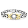 A single diamond circle set in 18K gold X-motifs accent this sterling silver Caviar beaded bracelet. LAGOS diamonds are the highest quality natural stones.