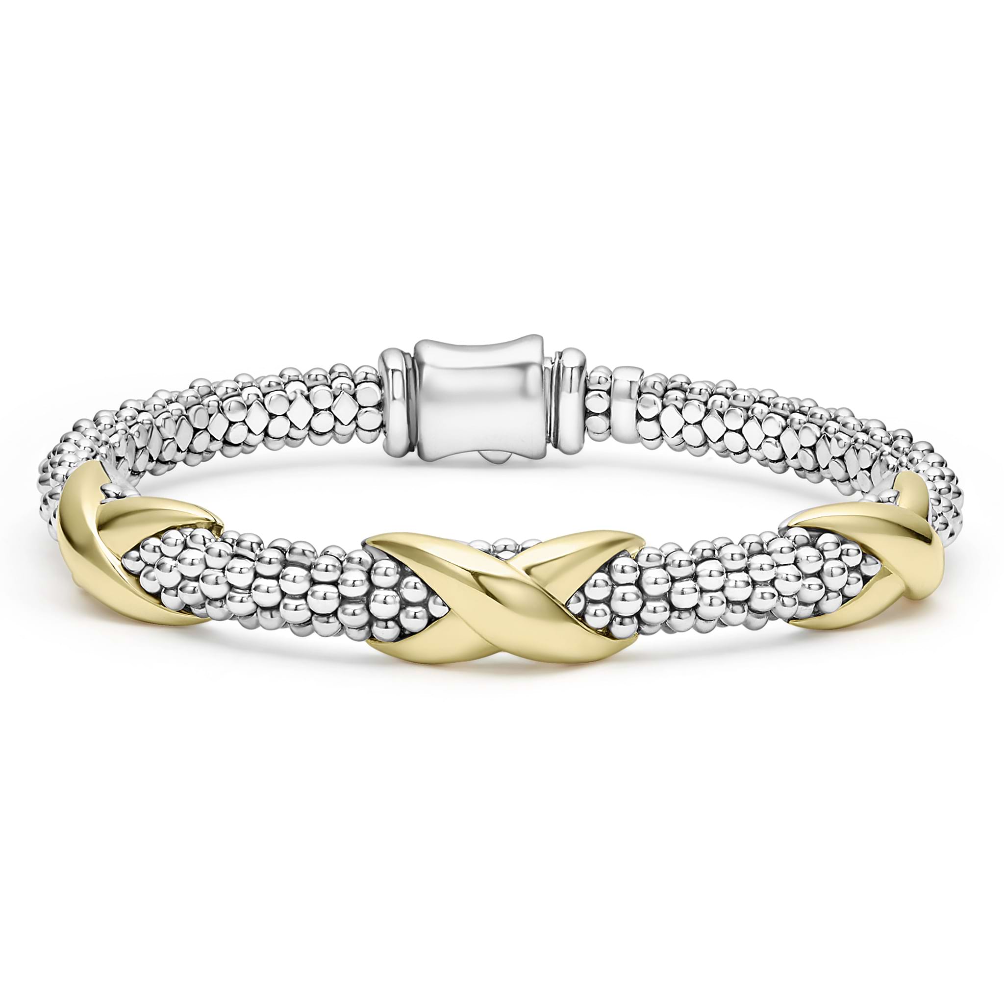 Sterling silver Caviar beading accented by three 18K gold X stations form this detailed LAGOS bracelet.