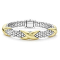 Sterling silver Caviar beading accented by three 18k gold X stations form this detailed LAGOS bracelet.