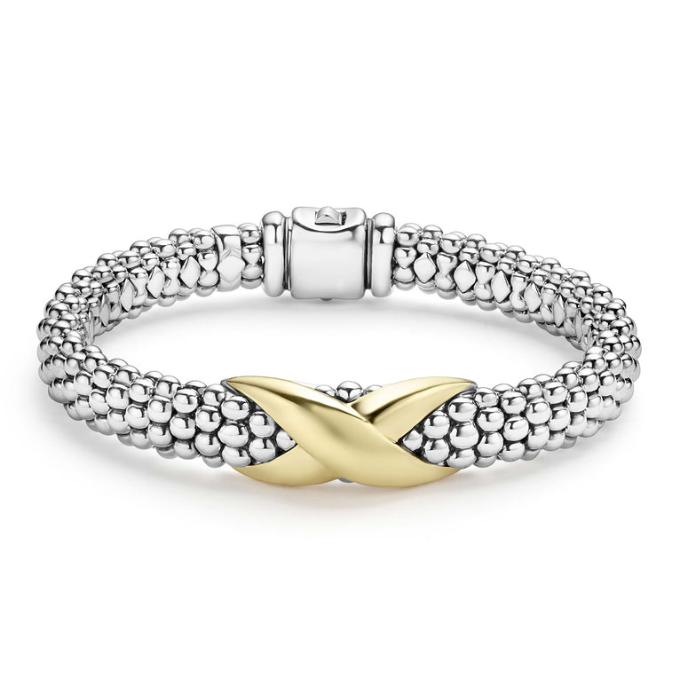 Smooth 18K Gold and sterling silver Caviar beading form this X station bracelet.
