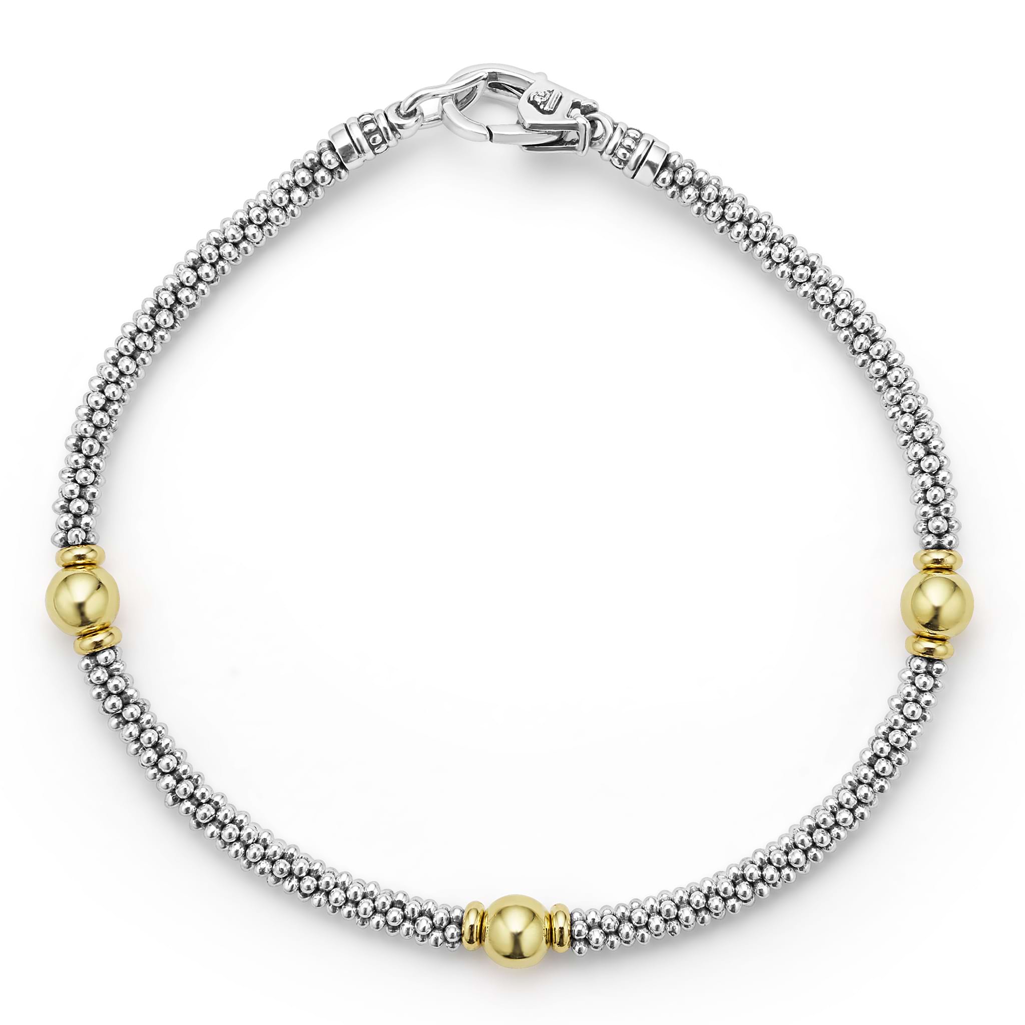 Three smooth stations of 18K gold and sterling silver Caviar beading form this rope bracelet.