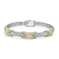 Sterling silver Caviar beading accented by three 18K gold and diamond X stations form this detailed bracelet. LAGOS diamonds are the highest quality natural stones.