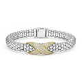 Smooth 18K gold, diamonds, and sterling silver Caviar beading form this X station bracelet. LAGOS diamonds are the highest quality natural stones.