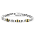 Three 18K gold and black ceramic stations with sterling silver Caviar beading form this signature bracelet.
