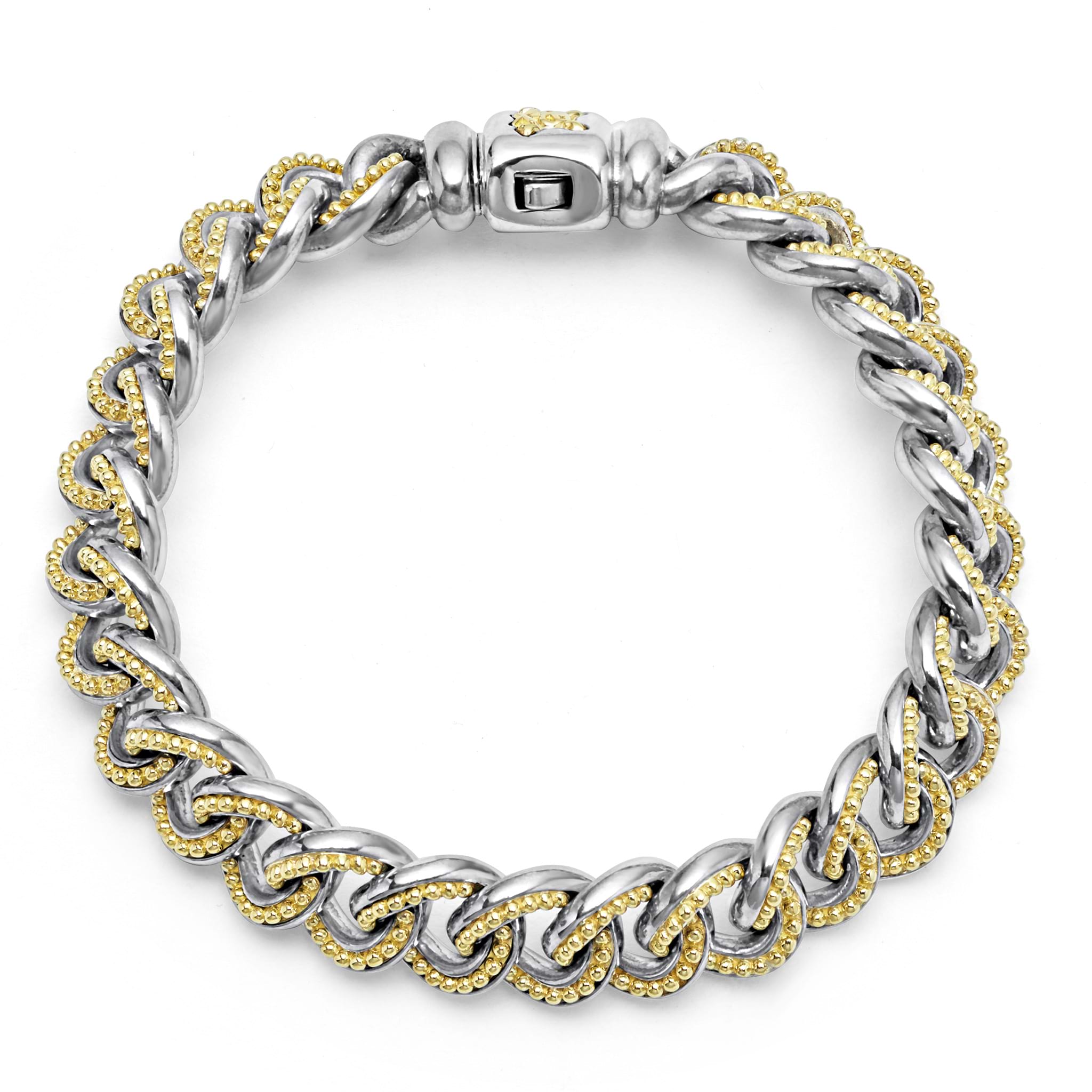 18K gold and sterling silver Caviar beading forms this curb link bracelet.