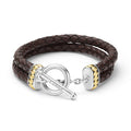 Brown braided leather bracelet with silver and gold clasp on a white background