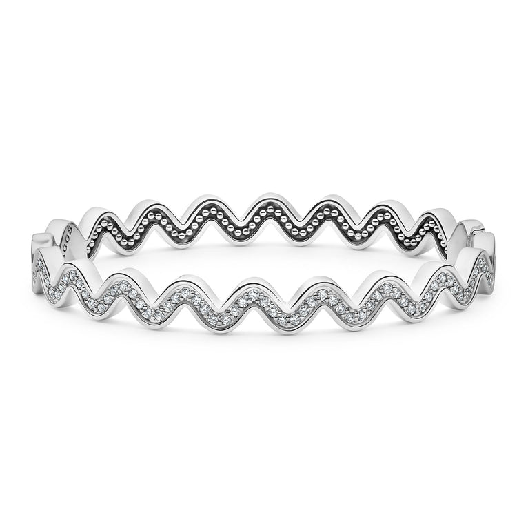 Sterling silver and diamonds form this wave bangle bracelet. LAGOS diamonds are the highest quality natural stones.
