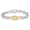18K gold, sterling silver, and diamonds form this interlocking link bracelet. LAGOS diamonds are the highest quality natural stone.