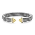 Titanium, 18K gold, and diamonds form this cuff with Caviar beading details. LAGOS diamonds are the highest quality natural stones.