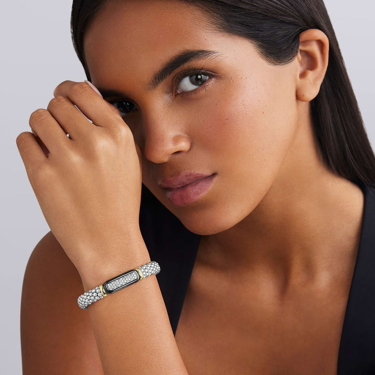 woman wearing 9mm sterling silver beaded diamond bracelet with black ceramic and gold details