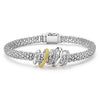 Smooth sterling silver, 18K gold superfine Caviar beading, and diamonds form five stationary rings on a classic sterling silver Caviar rope bracelet. LAGOS diamonds are the highest quality natural stones.
