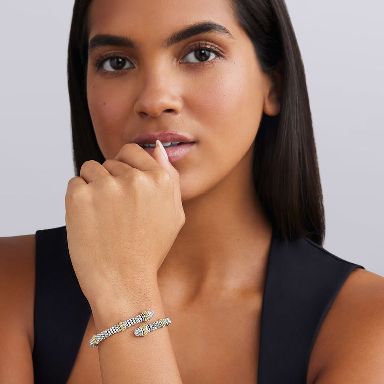 woman wearing 5mm sterling silver bypass bracelet with gold and diamond accents