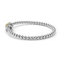 side of sterling silver beaded stretch bracelet with diamonds and gold ring details 