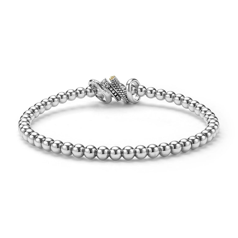 back of sterling silver beaded stretch bracelet with diamonds and gold ring details 