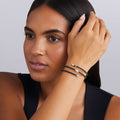 woman wearing black ceramic beading with sterling silver station wrap bracelet