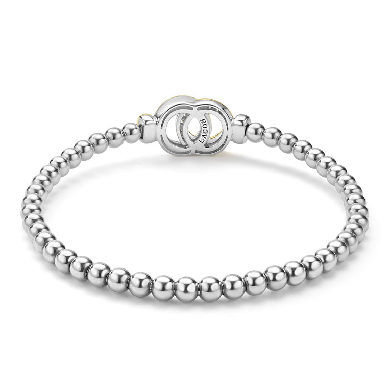 back of everyday sterling silver beaded stretch bracelet with interlocking diamonds and gold details 