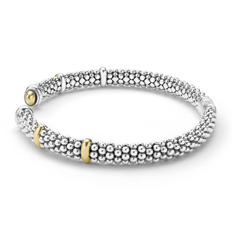 side of 5mm sterling silver cuff-style bracelet with gold beaded accents