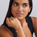 woman wearing 5mm sterling silver cuff-style bracelet with gold beaded accents