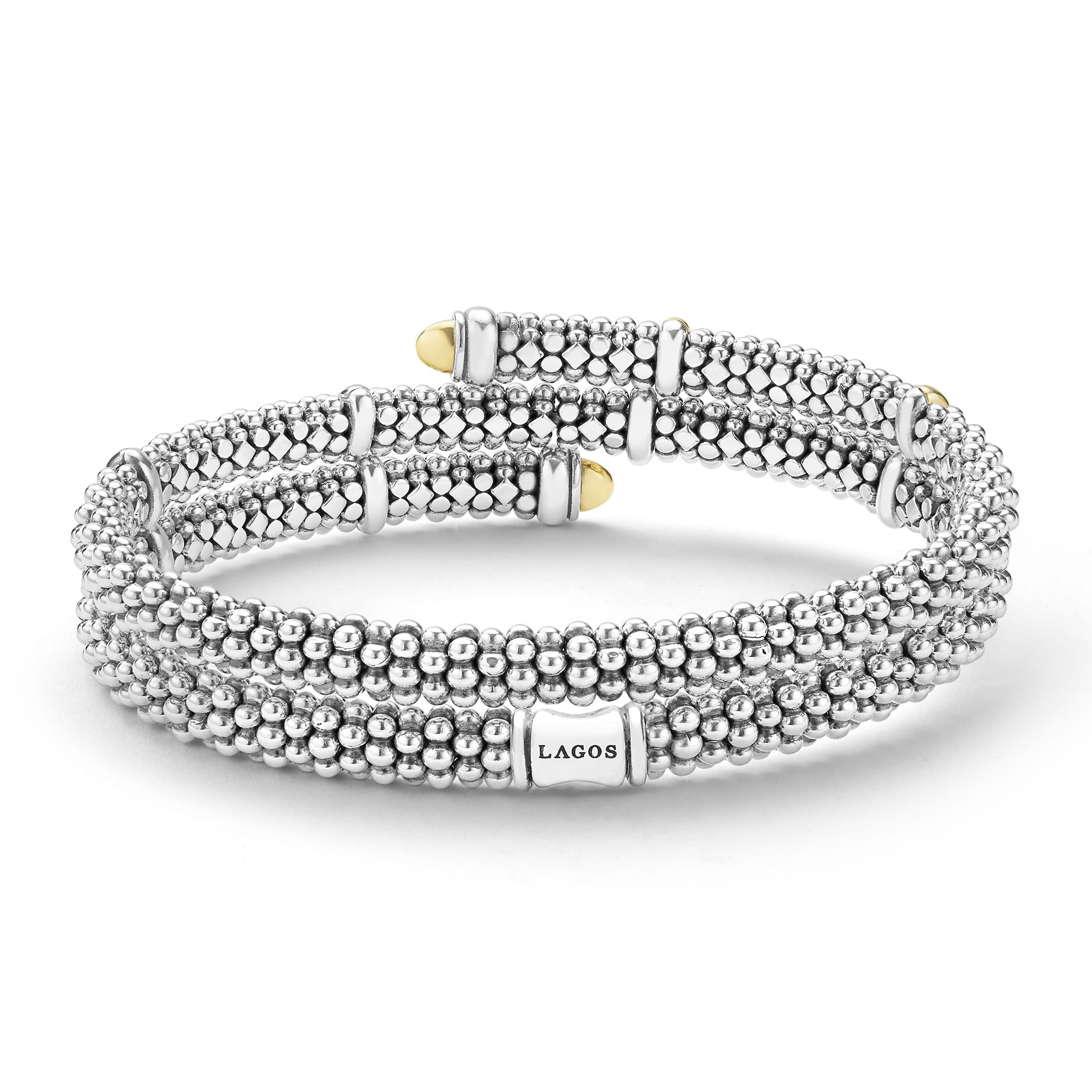 back of 5mm sterling silver wrap bracelet with gold beaded accents with LAGOS engravement 
