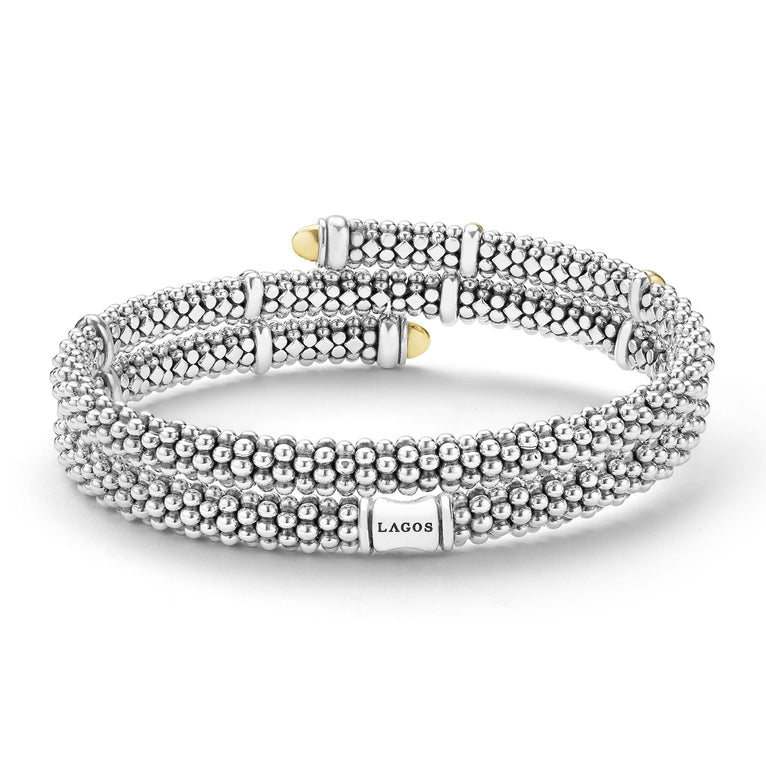 back of 5mm sterling silver wrap bracelet with gold beaded accents with LAGOS engravement 