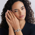 Young woman wearing Signature Caviar Sterling Silver Link Bracelet with chunky design and toggle clasp, highlighting refined craftsmanship and modern elegance.