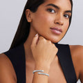 woman wearing 5mm sterling silver bypass bracelet with X stations