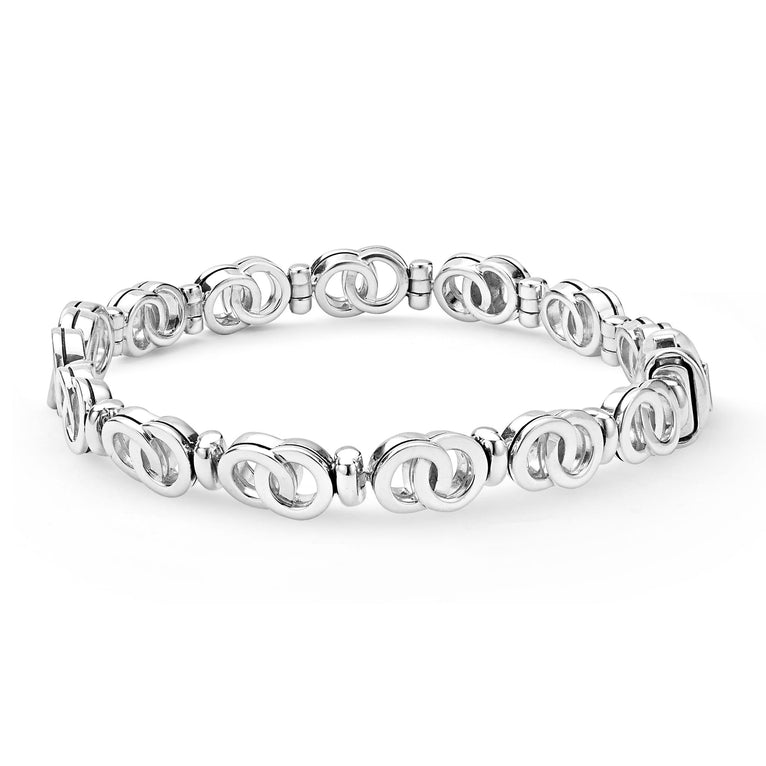Signature Caviar Silver Petite Interlocking Diamond Link Bracelet features concentric silver rings with diamond accents, forming an elegant, continuous chain of timeless sophistication.