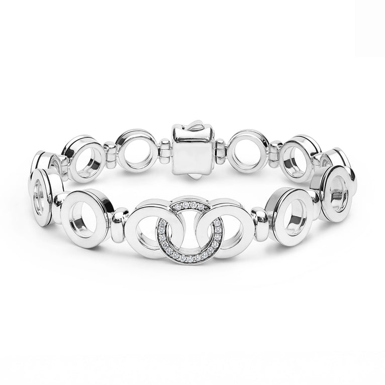 Signature Caviar Silver Interlocking Diamond Link Bracelet with polished and crystal-studded circular links, showcasing LAGOS craftsmanship and elegance.