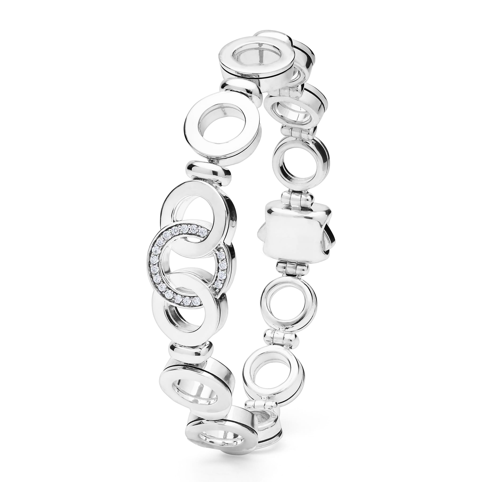 Signature Caviar Silver Interlocking Diamond Link Bracelet featuring cascading silver-tone dangle earrings with open circle links, some adorned with pavé-set diamonds, embodying elegance and sophistication.
