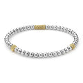 Caviar Icon Two-Tone Stretch Bracelet with polished silver beads and gold accents, showcasing LAGOS signature Caviar beading for elegant, versatile wear.