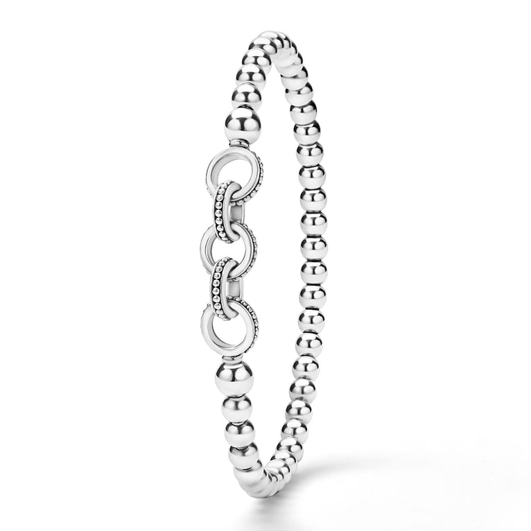 upright view of silver bracelet with interlocking circle design on a white background